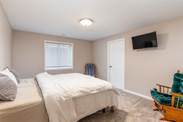 carpeted bedroom with baseboards