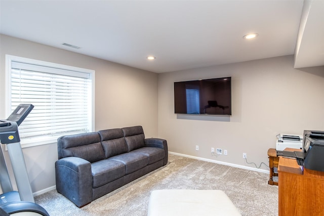 carpeted living area featuring visible vents, recessed lighting, and baseboards