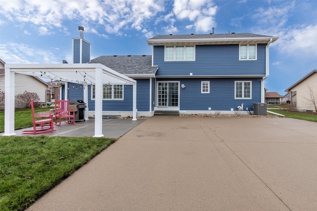 rear view of house featuring central AC unit, a lawn, a chimney, a patio area, and a pergola