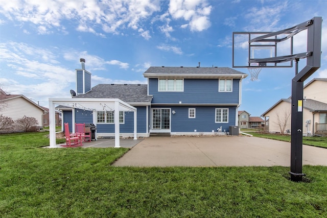 back of property with a patio, a lawn, central AC, and a chimney