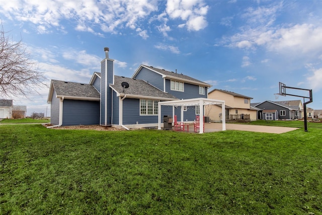 back of property with roof with shingles, a yard, a pergola, a chimney, and a patio area