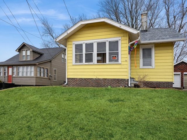 exterior space featuring a lawn and a chimney