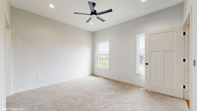 202 Meadowlark Dr, Monroe, IA 50170 - entryway featuring light colored carpet, a ceiling fan, recessed lighting, and baseboards