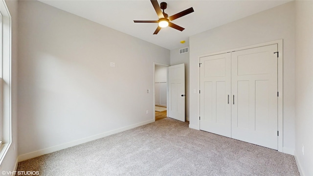 202 Meadowlark Dr, Monroe, IA 50170 - unfurnished bedroom with carpet flooring, baseboards, a closet, and ceiling fan