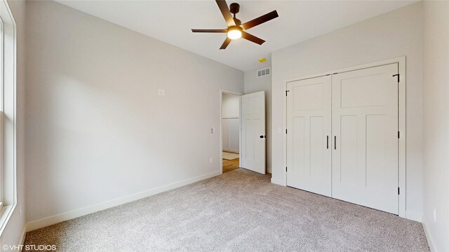 202 Meadowlark Dr, Monroe, IA 50170 - unfurnished bedroom with carpet floors, a closet, and ceiling fan