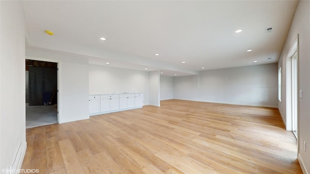 202 Meadowlark Dr, Monroe, IA 50170 - unfurnished room with light wood finished floors, recessed lighting, and baseboards