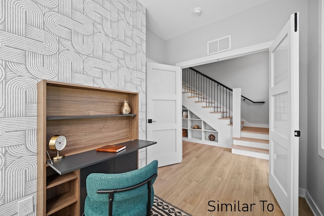 4828 Ingersoll Ave, Des Moines, IA 50312 - office area with wood finished floors, visible vents, and baseboards