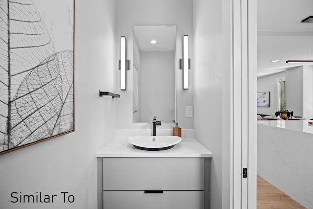 4828 Ingersoll Ave, Des Moines, IA 50312 - bathroom with vanity and wood finished floors