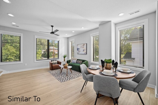 4828 Ingersoll Ave, Des Moines, IA 50312 - dining space featuring recessed lighting, visible vents, light wood-style flooring, and a textured ceiling