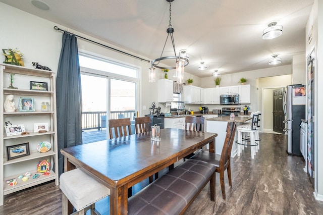 dining room featuring dark wood-style flooring