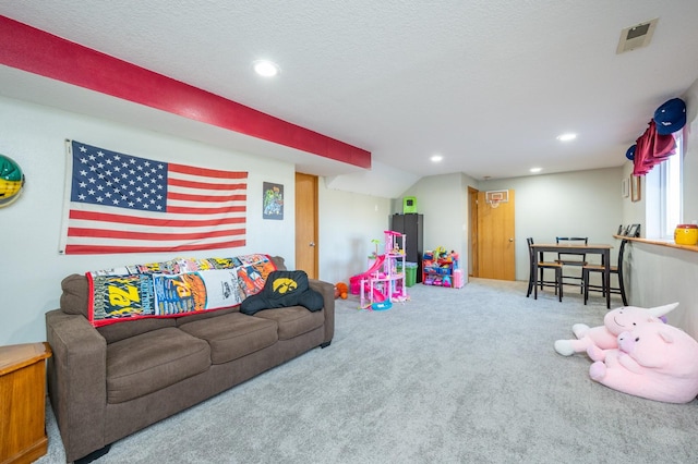 playroom with recessed lighting, visible vents, a textured ceiling, and carpet flooring