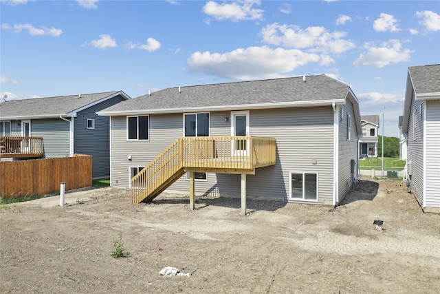 2917 Jerry St, Van Meter, IA 50261 - rear view of house featuring a deck, stairs, and roof with shingles