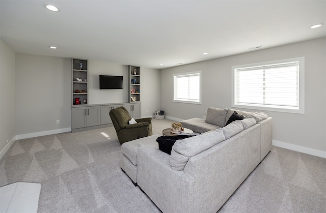 5015 149th Ct, Urbandale, IA 50323 - living area with recessed lighting, light carpet, and built in features