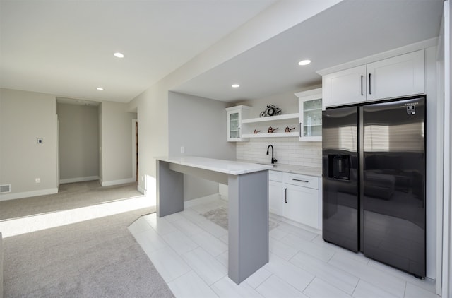 5015 149th Ct, Urbandale, IA 50323 - kitchen with stainless steel fridge with ice dispenser, open shelves, white cabinetry, glass insert cabinets, and recessed lighting