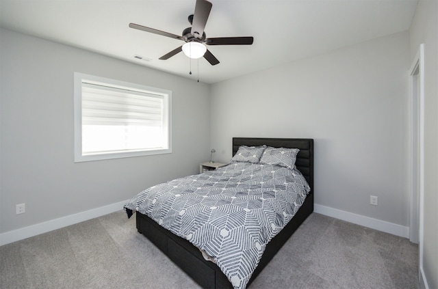 5015 149th Ct, Urbandale, IA 50323 - carpeted bedroom with baseboards and ceiling fan