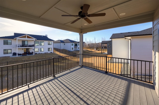 wooden terrace with a residential view, a patio, ceiling fan, and fence