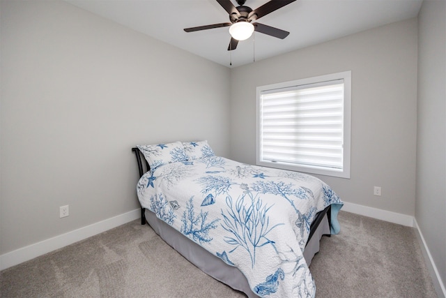 bedroom with carpet flooring, a ceiling fan, and baseboards