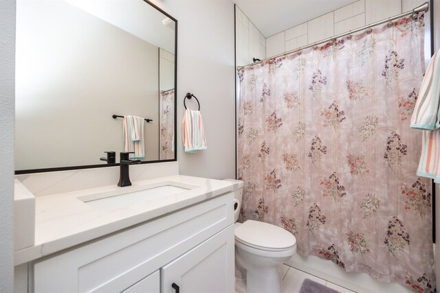 bathroom with toilet and vanity