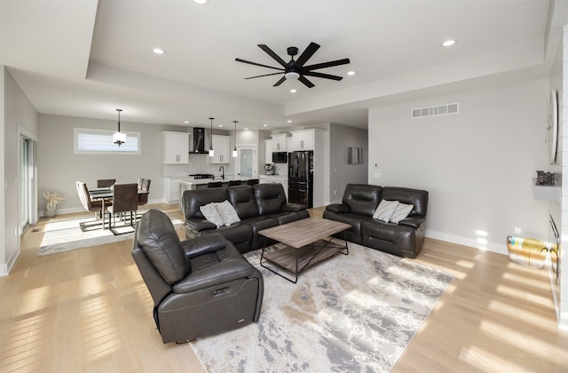 5015 149th Ct, Urbandale, IA 50323 - living area with a ceiling fan, light wood-style flooring, and recessed lighting