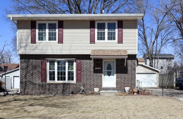 view of front of house featuring brick siding and an outdoor structure