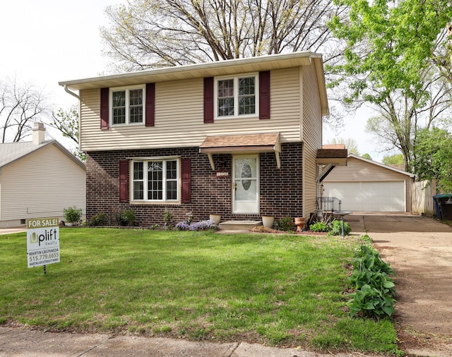 view of front of house with brick siding, an outdoor structure, a front lawn, and a garage