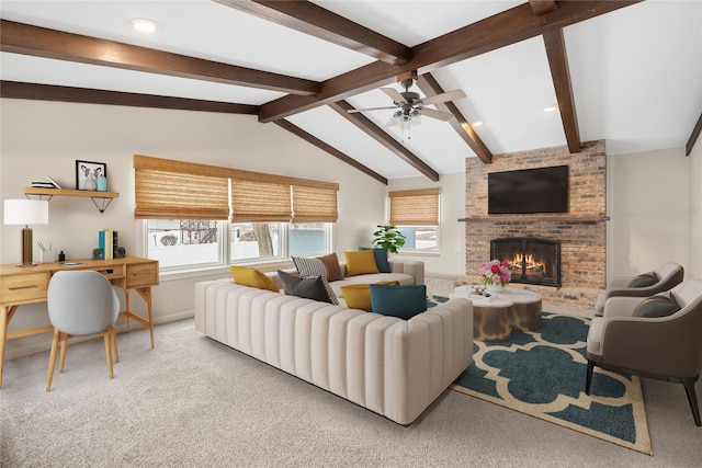 carpeted living area with lofted ceiling with beams, a brick fireplace, a ceiling fan, and baseboards