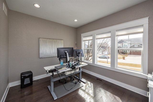 office with visible vents, baseboards, and dark wood-style floors