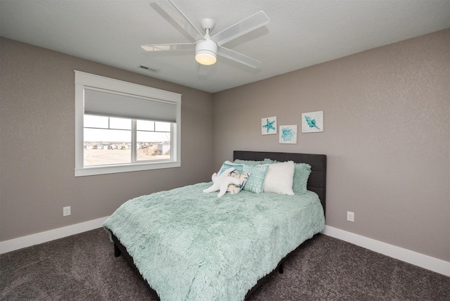 bedroom featuring visible vents, baseboards, carpet, and a ceiling fan