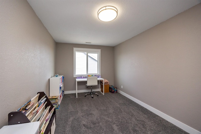 office area featuring carpet flooring, visible vents, and baseboards