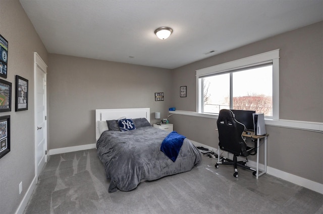 bedroom with visible vents, baseboards, and carpet flooring