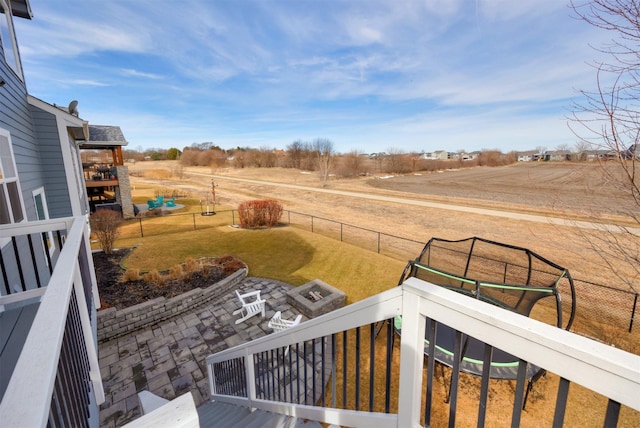 view of yard featuring a patio, a rural view, and a fenced backyard