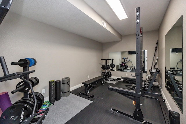 gym with visible vents and baseboards