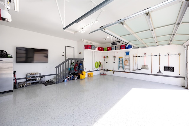 garage with freestanding refrigerator