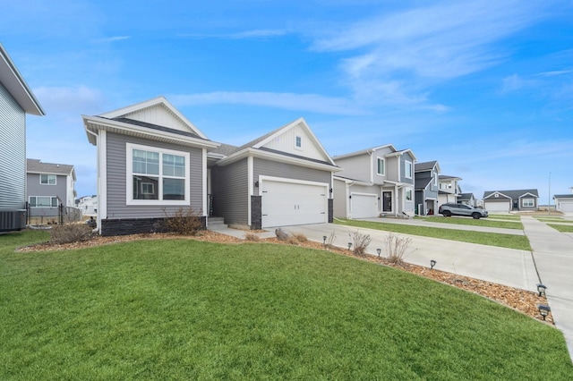 view of front facade with a front lawn, a residential view, board and batten siding, concrete driveway, and an attached garage