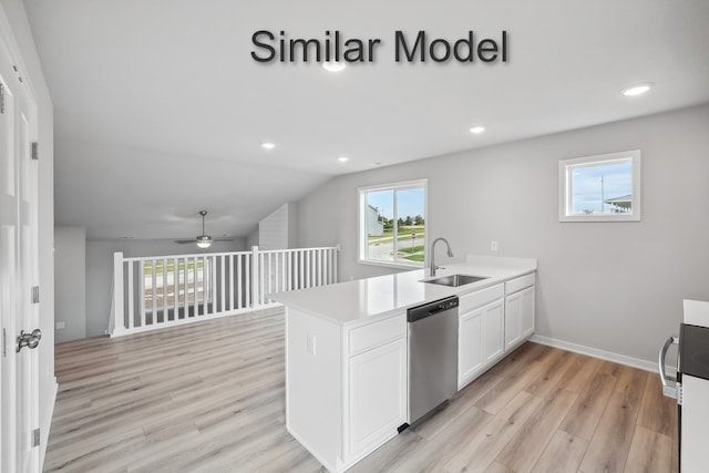 kitchen with dishwasher, light wood-style flooring, a peninsula, white cabinets, and a sink