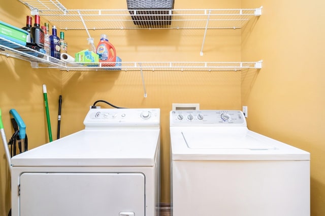 washroom featuring washer and dryer and laundry area