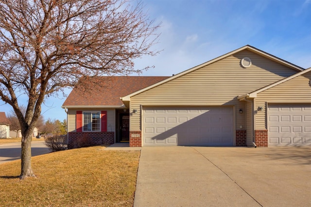 single story home with brick siding, a shingled roof, a front lawn, concrete driveway, and an attached garage