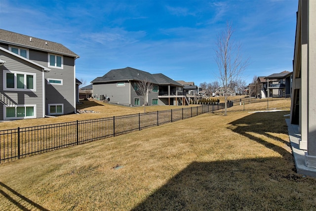 view of yard with fence and a residential view