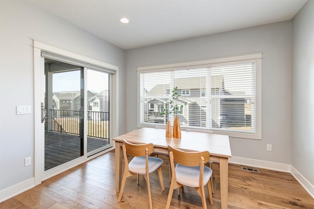 dining space featuring recessed lighting, baseboards, visible vents, and light wood-type flooring