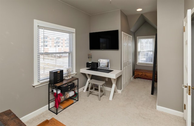 office with plenty of natural light, baseboards, and light colored carpet