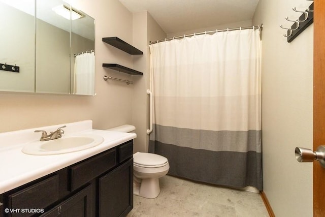 full bathroom featuring vanity, curtained shower, and toilet