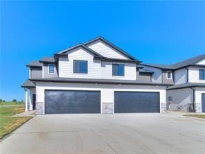 view of front facade with an attached garage and driveway