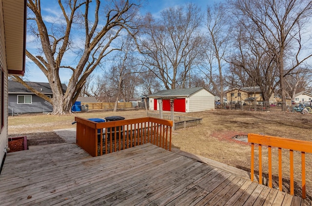 deck featuring an outbuilding and a fenced backyard