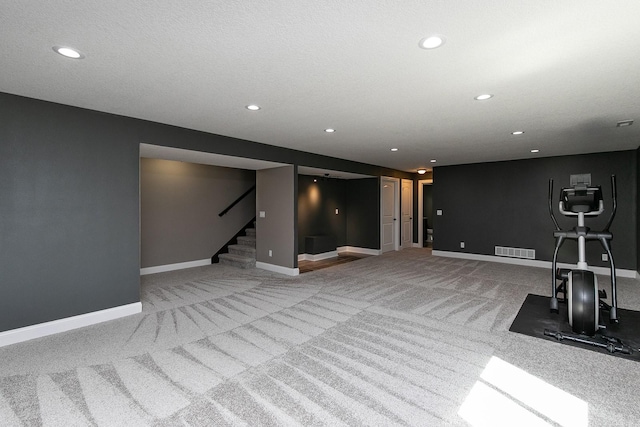 exercise area featuring recessed lighting, visible vents, carpet floors, and baseboards