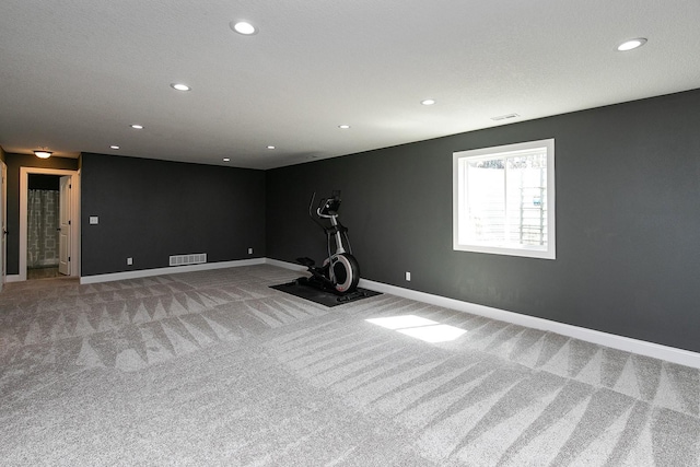 workout area featuring visible vents, recessed lighting, baseboards, and carpet floors