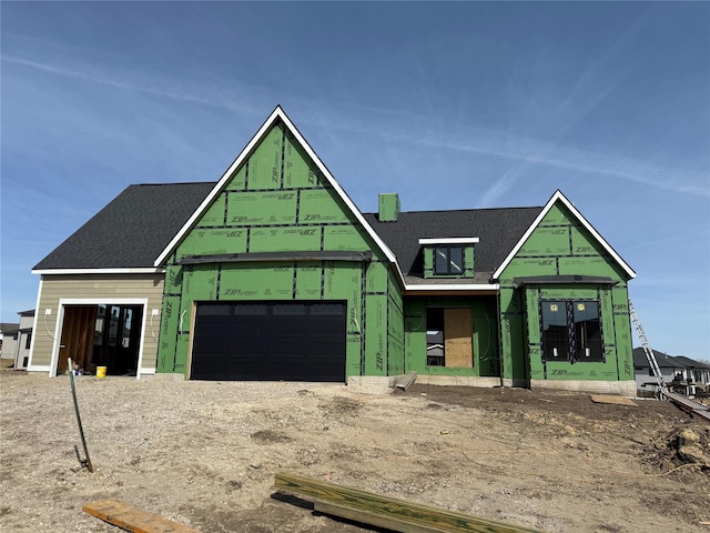 property under construction featuring a garage and driveway