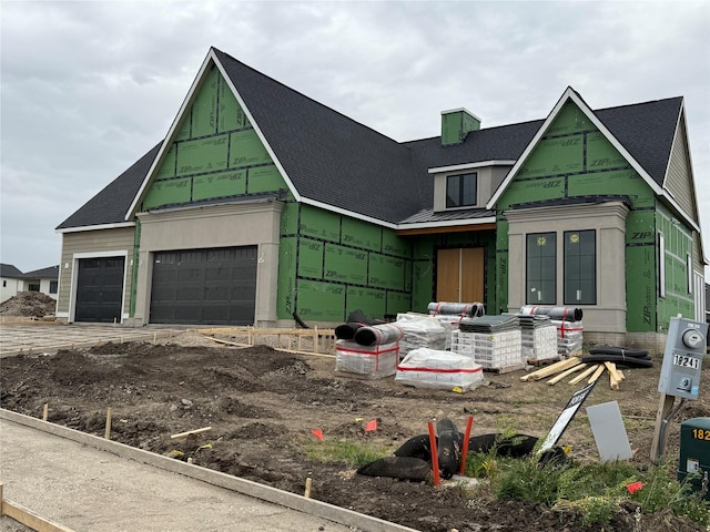 18241 Baxter Pl, Clive, IA 50325 - unfinished property featuring a shingled roof, an attached garage, a chimney, and driveway
