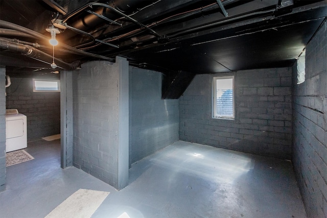 basement featuring washer / dryer and a wealth of natural light