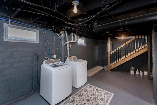 basement with stairs and washer and clothes dryer