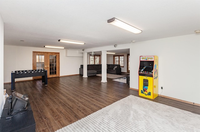 exercise area with french doors, baseboards, and wood finished floors